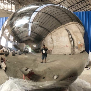 large metal garden spheres with mirror polished