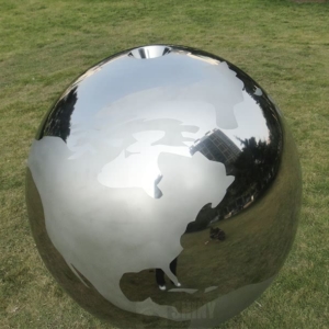 Steel sphere water fountain world map covered