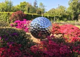 large steel golf ball sculpture