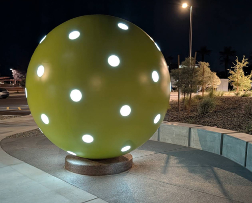large stainless steel pickleball in night view