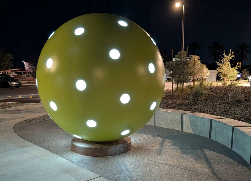 large stainless steel pickleball in night view